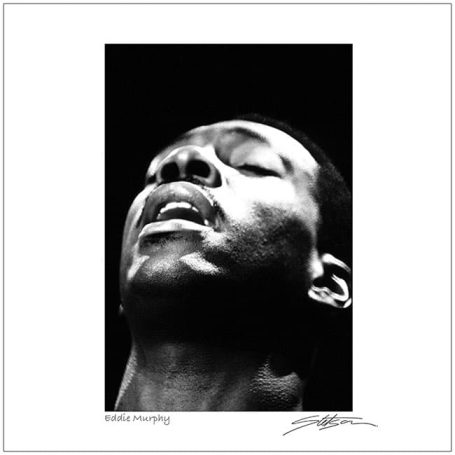A close-up of a man with eyes closed, expressing deep emotion against a dark background.