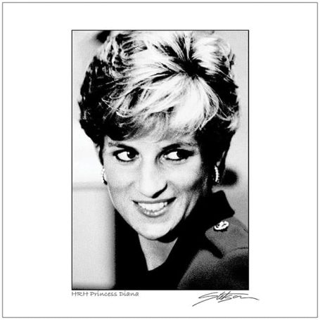 Black and white portrait of a smiling woman with short hair, wearing a blazer.