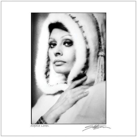 A woman in a fur-lined hooded cloak, exuding elegance and a contemplative expression.