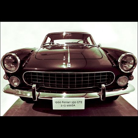 Classic black Ferrari 250 GT with a sleek design and prominent front grille.