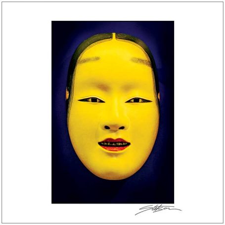 A vibrant yellow traditional mask with a serene expression and red accents.