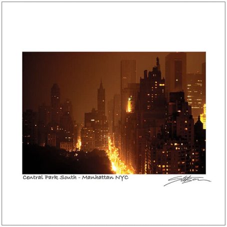 City skyline at night with glowing lights and a hazy atmosphere.