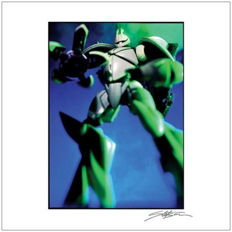 A green robotic figure posed dramatically against a blue background.