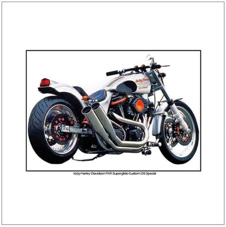 A silver motorcycle with a wide rear tire and prominent exhaust pipes.