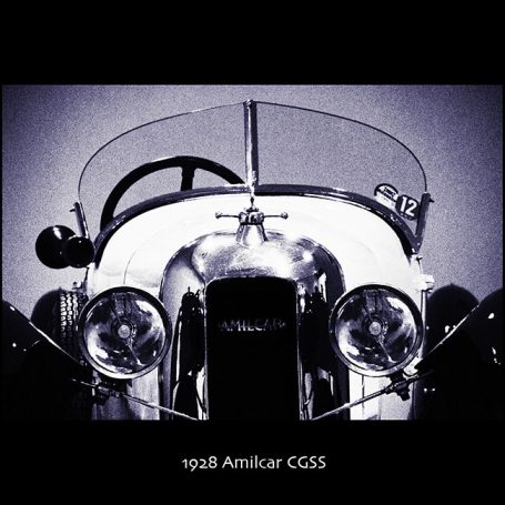 Vintage car front view with chrome detailing and prominent headlights.