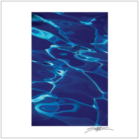 Rippling blue water with light reflections and gentle wave patterns.