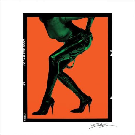 A silhouette of a person in high heels against an orange background.