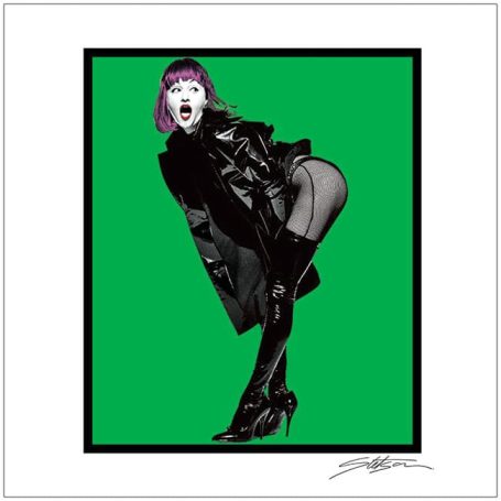 A striking figure in black attire and high heels poses against a vibrant green background.