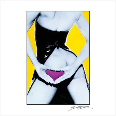 A person forming a heart shape with their hands over their abdomen against a bright background.