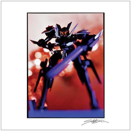 A model robot stands poised with a dynamic pose against a blurred, colourful background.